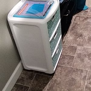 Rolling three tier storage bin